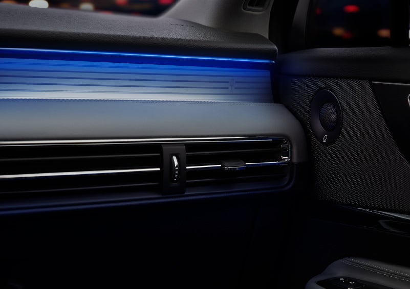 A thin available ambient blue lighting illuminates the pinstripe aluminum under an ebony dashboard, emitting a cool energy | Klaben Lincoln of Warren in Warren OH