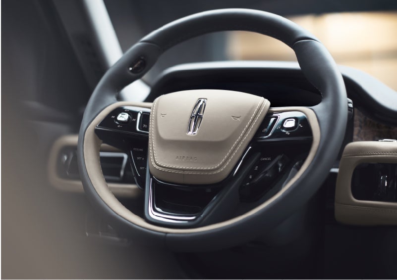 The intuitively placed controls of the steering wheel on a 2023 Lincoln Aviator® SUV | Klaben Lincoln of Warren in Warren OH