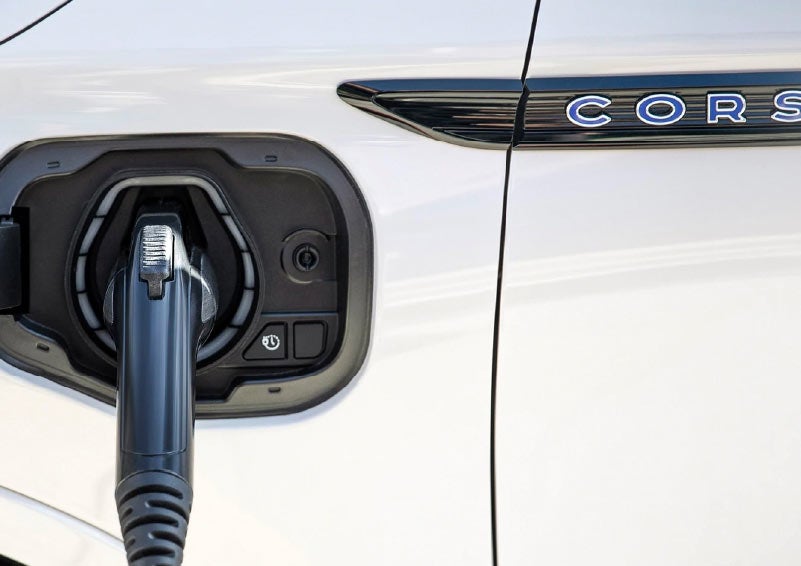 A charging chord is shown connected to a Lincoln Corsair Grand Touring