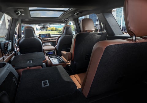 The interior of the 2025 Lincoln Aviator® SUV is shown with two seats folded down for added space. | Klaben Lincoln of Warren in Warren OH