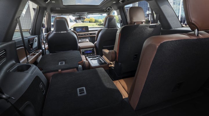 One side of the PowerFold® third-row seat and a second-row seat are folded forward in the 2026 Lincoln Aviator® SUV. | Klaben Lincoln of Warren in Warren OH