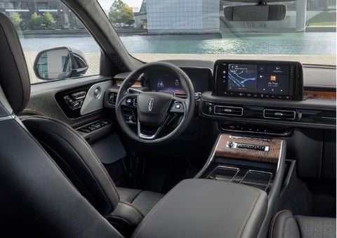 The interior of the 2026 Lincoln Aviator® SUV is shown parked with a view of a harbor through the windshield. | Klaben Lincoln of Warren in Warren OH