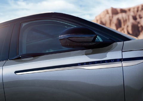 Blue lettering on the side of the vehicle that reads Nautilus indicates the available Hybrid Powertrain. | Klaben Lincoln of Warren in Warren OH