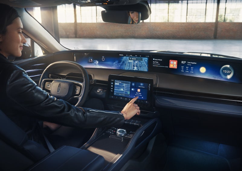 The driver of a 2026 Lincoln Nautilus® SUV interacts with the center touchscreen. | Klaben Lincoln of Warren in Warren OH