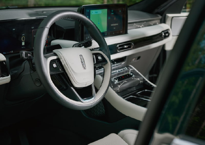 The leather-trimmed steering wheel of a 2027 Lincoln Aviator® Black Label™ SUV. | Klaben Lincoln of Warren in Warren OH